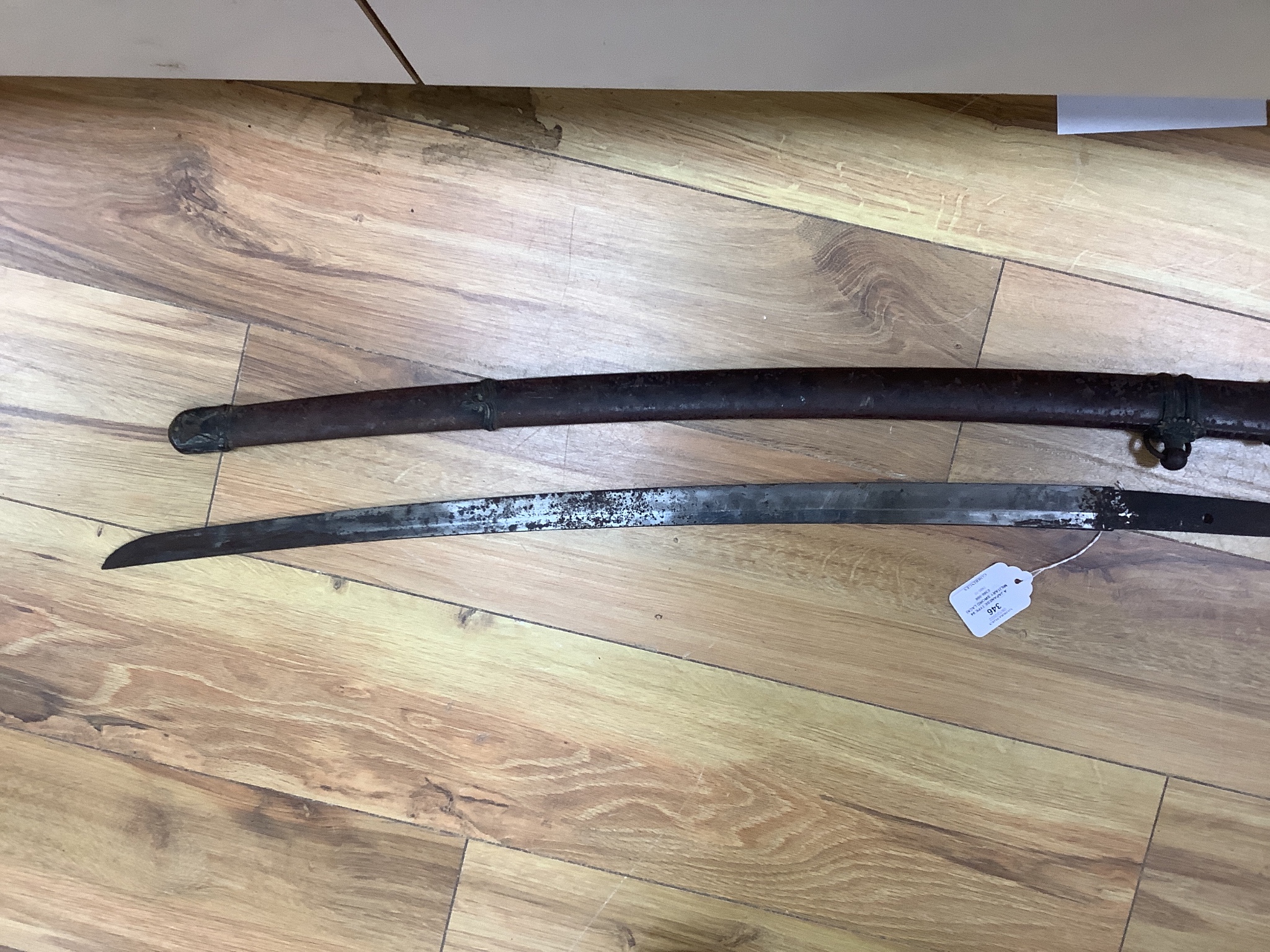 A Japanese Type 94 military sword lacking tsuba and hilt. Signed tang. 90cm excl scabbard